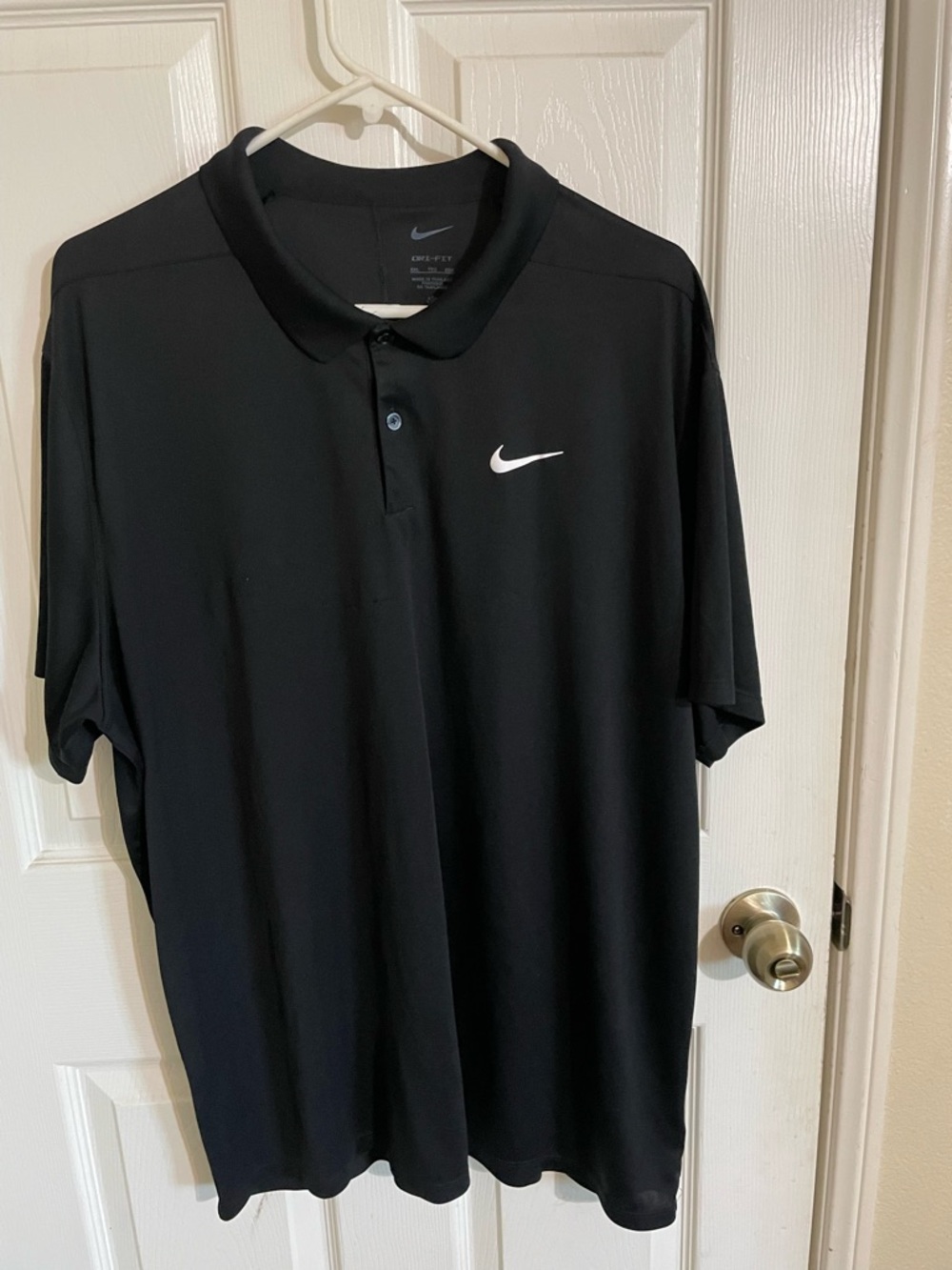 Nike Black Polo Shirt with White Swoosh